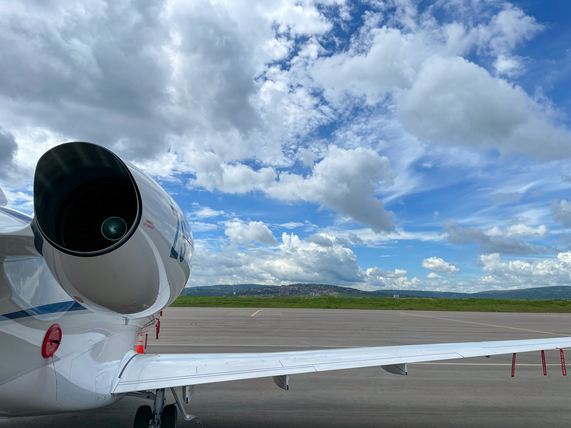 Jet engine and wing close-up on sunny day