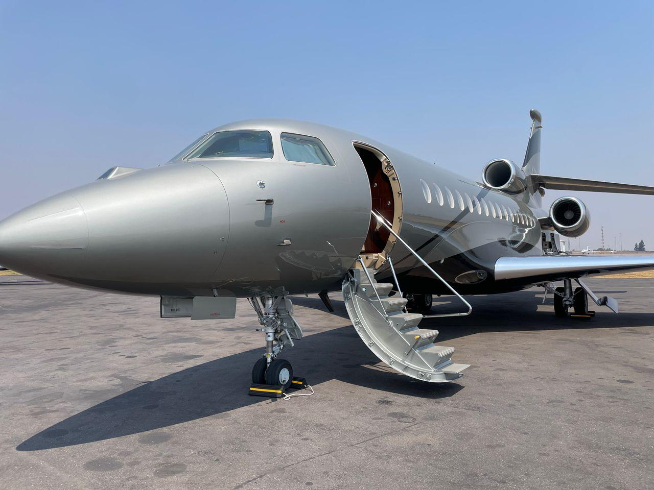 Private jet on tarmac at sunset
